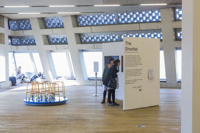 two women peering at Tate Exchange Shortlist artworks