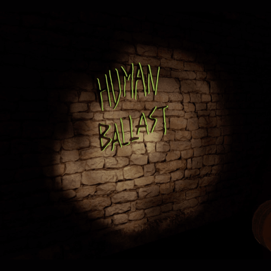 In-game screenshot. Perspective limited by the reach of the torchlight. The torch is being shone directly at a crumbling brick wall, highlighting a round space of visible graffiti. In black, scrawled text, ‘Human Ballast’ is written. The text is then further outlined in neon green, indicating it is an interactive object.
