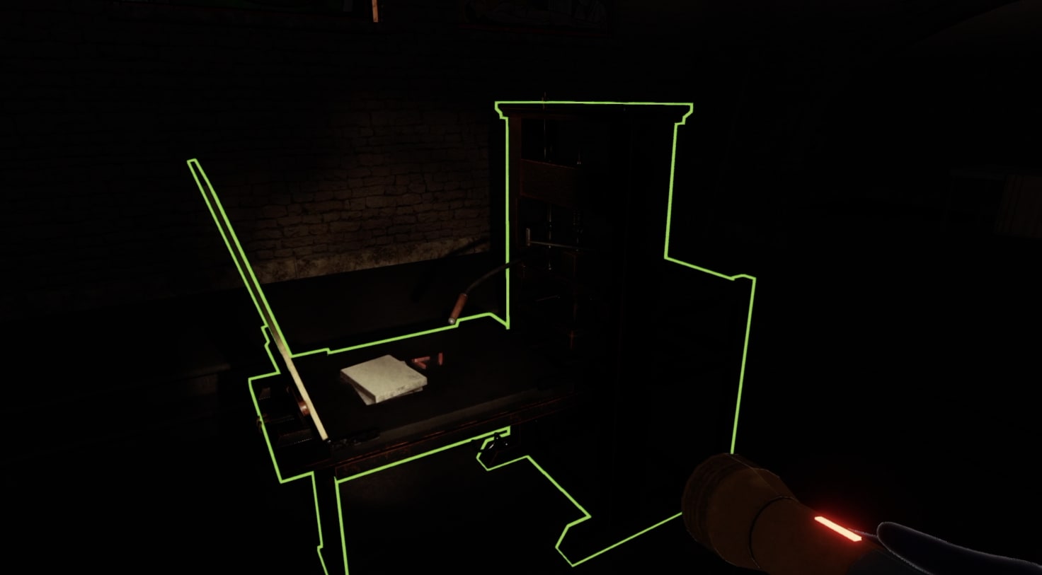 In-game screenshot focusing on the old fashioned printing press in the centre of the lower half of The Mine. The room is dark, perspective limited by the reach of the torchlight. The little light there is picks out a large metal printing press, details obscure but form clearly identifiable. The printing press itself is further outlined with a neon green line, indicating to a user of the game that it is an interactive object.