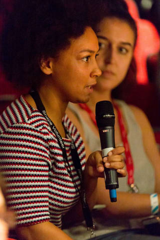 young audience member taking part in a panel discussion