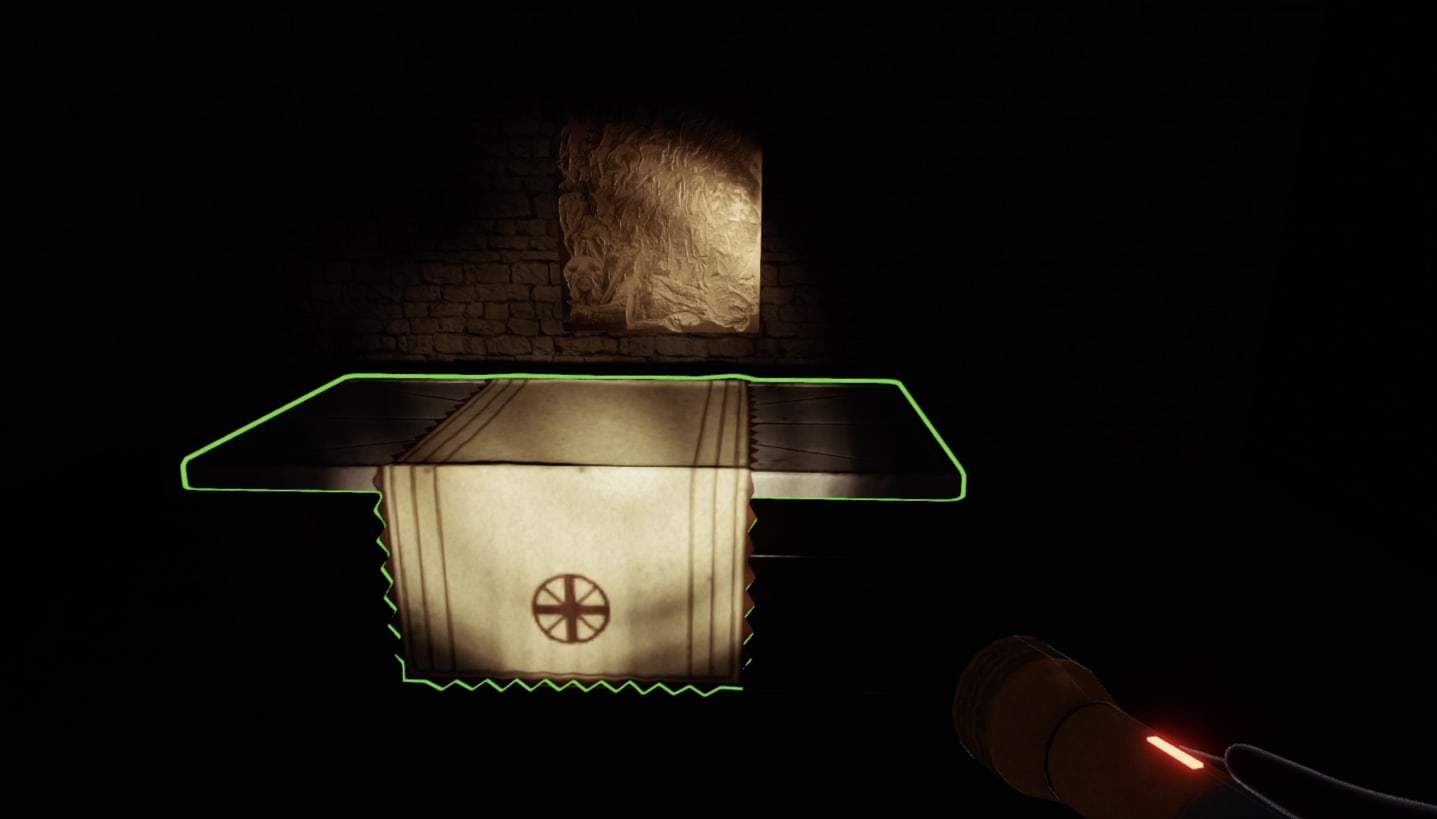 In-game screenshot focusing on an altar in an alcove within The Mine. Perspective limited by the reach of the torch light. Highlighted by the minimal lighting is an altar table, the base of which resembles a medical trolley or gurney, but it is draped across the middle with a heavy, maroon-rimmed linen cloth. At the end of the cloth is a crest, hanging down in front of the table.